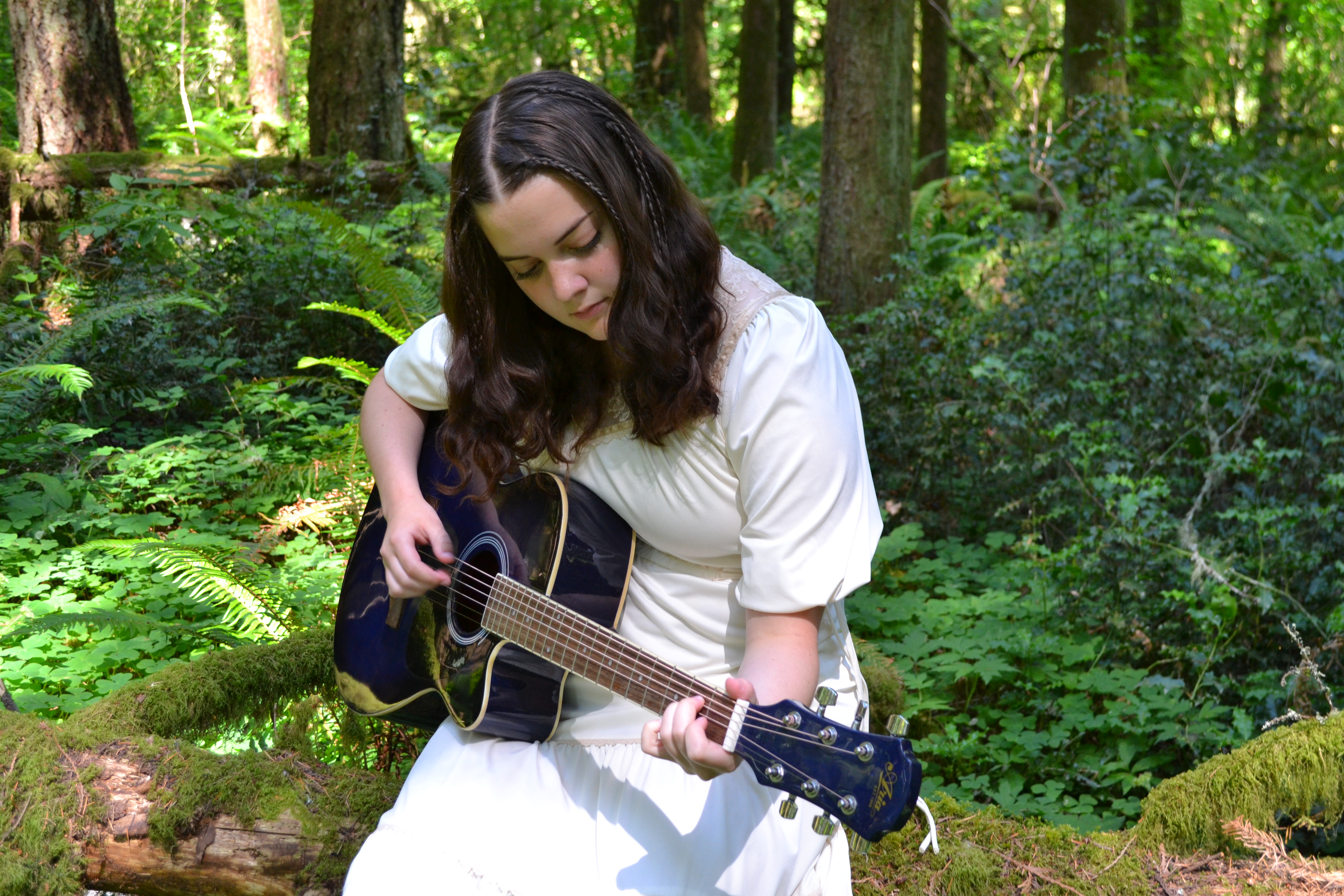 karina plays guiter in a haunted northwest forest